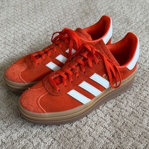 Adidas women’s Bold Orange and White platform Gazelles